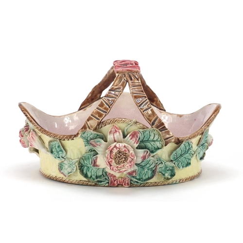 145 - Victorian Majolica pottery basket decorated in relief with flowers, 29cm wide