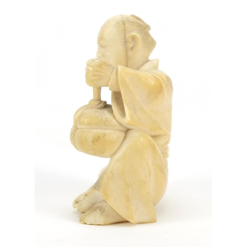 175 - Japanese carved ivory Okimono of a figure holding a basket, 6cm high