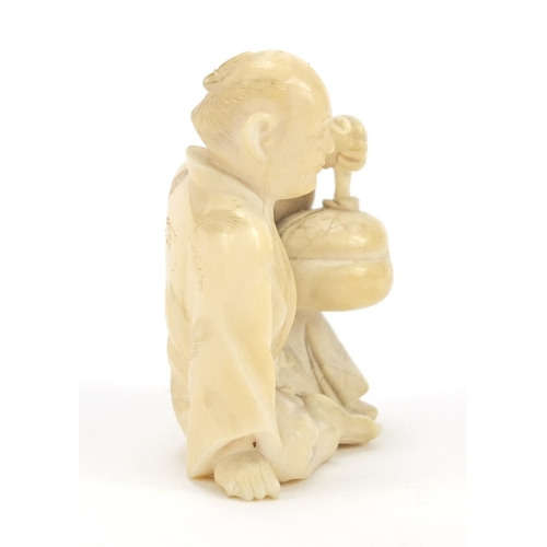 175 - Japanese carved ivory Okimono of a figure holding a basket, 6cm high