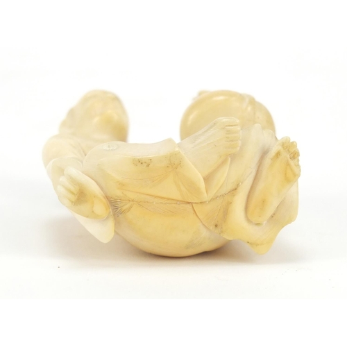175 - Japanese carved ivory Okimono of a figure holding a basket, 6cm high