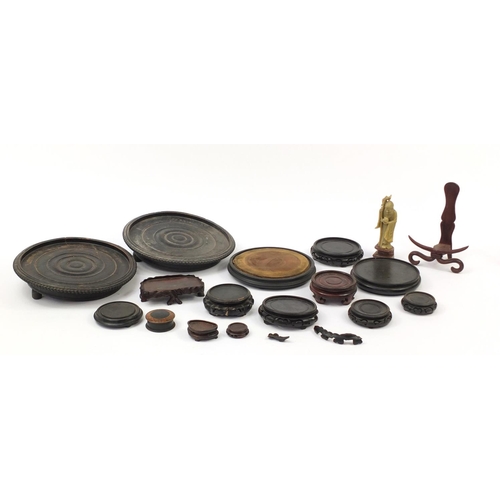 173 - Chinese carved soapstone figure of an Elder and collection of Chinese carved hardwood stands, each 3... 