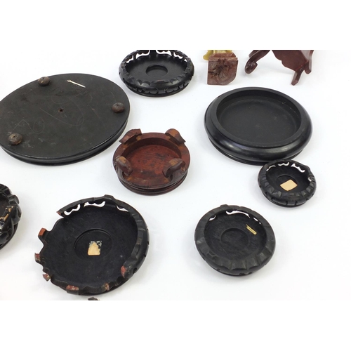 173 - Chinese carved soapstone figure of an Elder and collection of Chinese carved hardwood stands, each 3... 