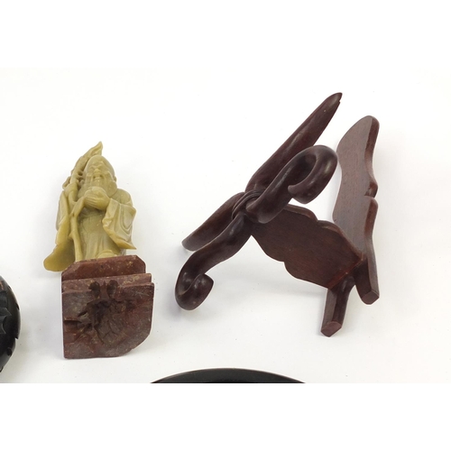 173 - Chinese carved soapstone figure of an Elder and collection of Chinese carved hardwood stands, each 3... 