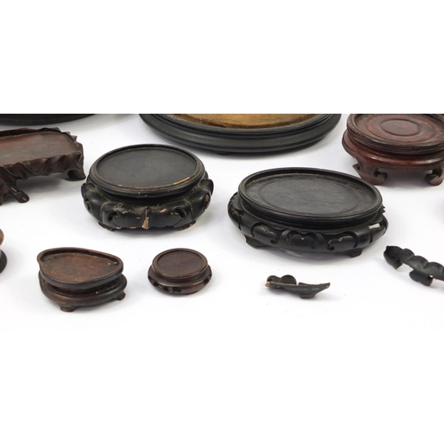 173 - Chinese carved soapstone figure of an Elder and collection of Chinese carved hardwood stands, each 3... 