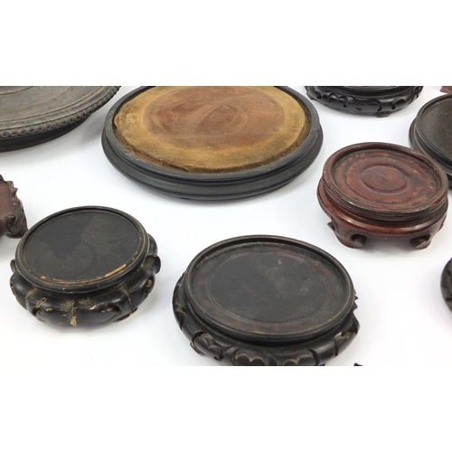 173 - Chinese carved soapstone figure of an Elder and collection of Chinese carved hardwood stands, each 3... 