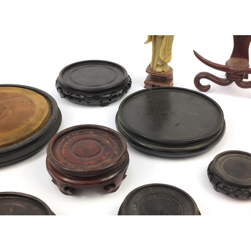 173 - Chinese carved soapstone figure of an Elder and collection of Chinese carved hardwood stands, each 3... 