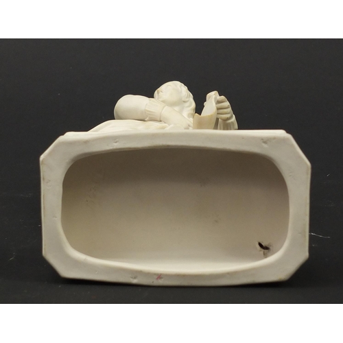 147 - Victorian parian figure of a man beside a pillar holding a scroll, 24.5cm high