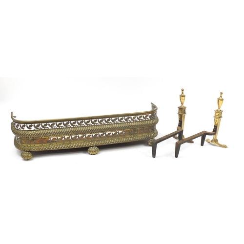2239 - Pair of Regency brass fire dogs with paw feet and a Victorian brass fender