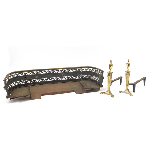 2239 - Pair of Regency brass fire dogs with paw feet and a Victorian brass fender