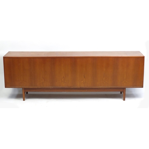 845 - 1970's sideboard fitted with four drawers above four cupboard doors, 233.5cm W x 78cm H x 46cm D