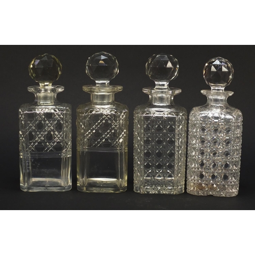 57 - Nine 19th century cut glass decanters with stoppers, each approximately 22.5cm high