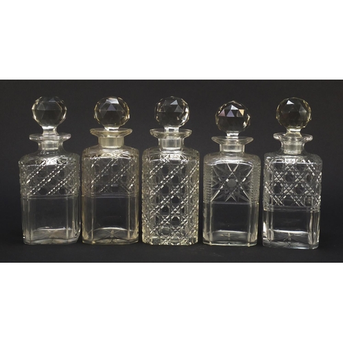 57 - Nine 19th century cut glass decanters with stoppers, each approximately 22.5cm high