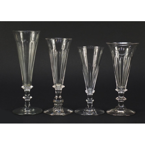 140 - Eight 18th/19th century Champagne flutes with blade collars and knopped stems, the largest 15.5cm hi... 