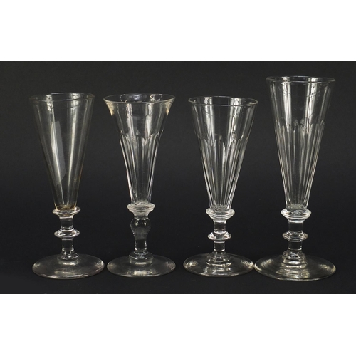 141 - Eight 18th/19th century Champagne flutes with blade collars and knopped stems, the largest 18cm high