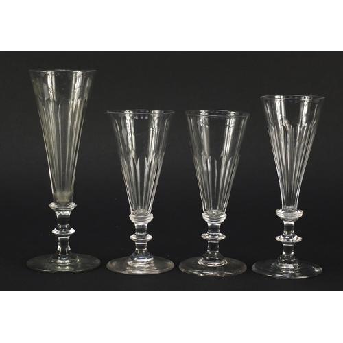 141 - Eight 18th/19th century Champagne flutes with blade collars and knopped stems, the largest 18cm high