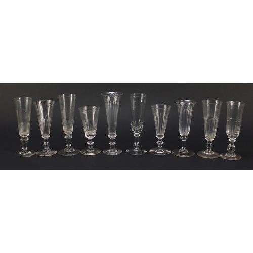 143 - Ten 18th/19th century Champagne flutes including examples with faceted knopped stems and blade colla... 
