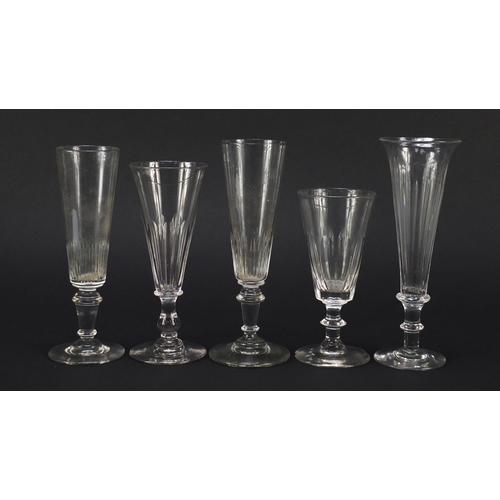 143 - Ten 18th/19th century Champagne flutes including examples with faceted knopped stems and blade colla... 
