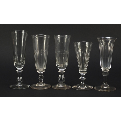 143 - Ten 18th/19th century Champagne flutes including examples with faceted knopped stems and blade colla... 