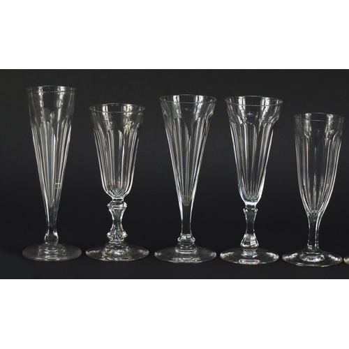 142 - Ten 18th/19th century faceted Champagne flutes, the largest 18.5cm high