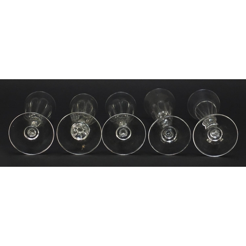 142 - Ten 18th/19th century faceted Champagne flutes, the largest 18.5cm high