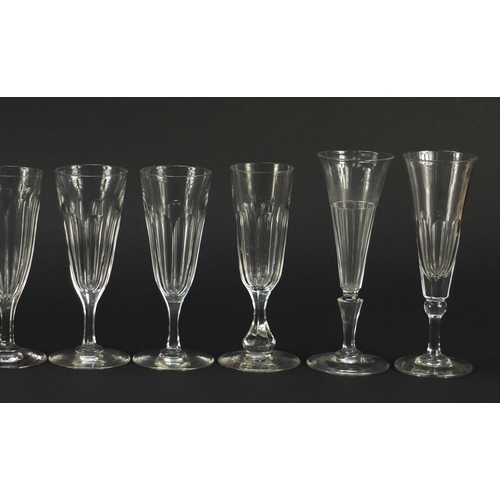 142 - Ten 18th/19th century faceted Champagne flutes, the largest 18.5cm high