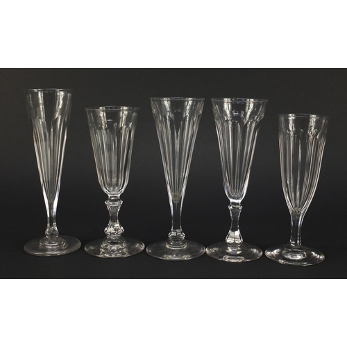 142 - Ten 18th/19th century faceted Champagne flutes, the largest 18.5cm high