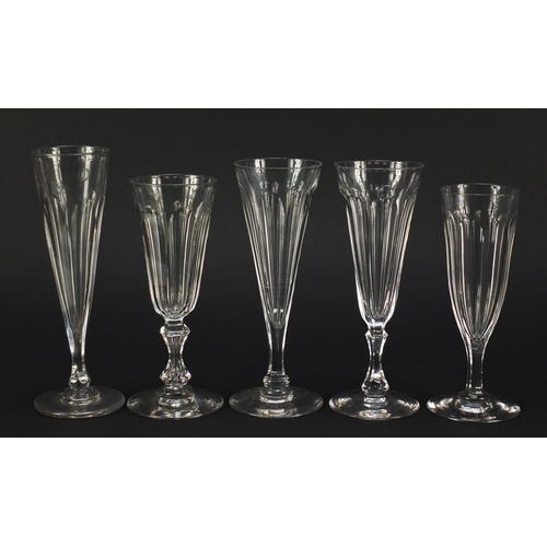 142 - Ten 18th/19th century faceted Champagne flutes, the largest 18.5cm high