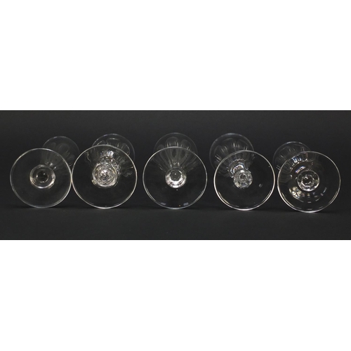 142 - Ten 18th/19th century faceted Champagne flutes, the largest 18.5cm high