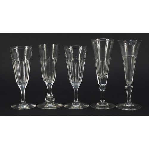 142 - Ten 18th/19th century faceted Champagne flutes, the largest 18.5cm high