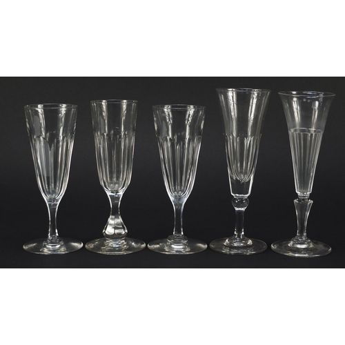 142 - Ten 18th/19th century faceted Champagne flutes, the largest 18.5cm high