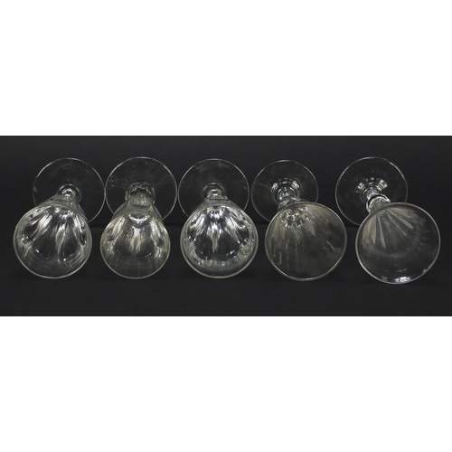 142 - Ten 18th/19th century faceted Champagne flutes, the largest 18.5cm high