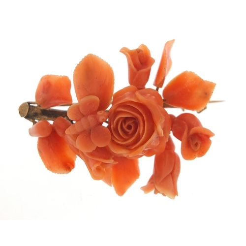 150 - Victorian unmarked gold and coral brooch, carved with a bee in flowers, (tests as 12ct gold) 6cm in ... 