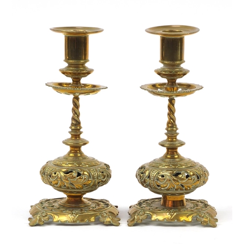 50 - Pair of early 20th century Arts & Crafts style candlesticks, cast and pierced with leaves, 23cm high