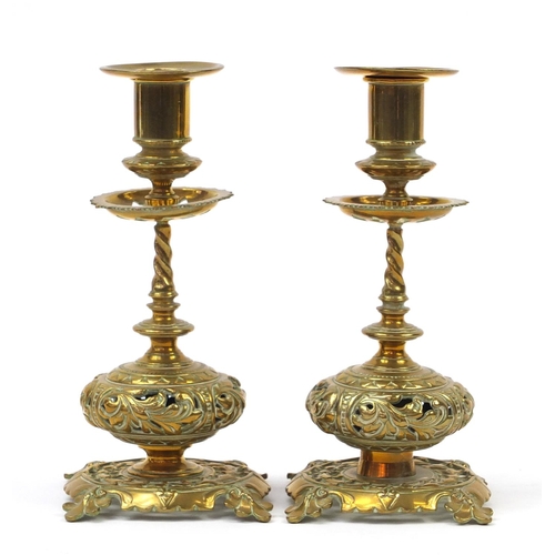 50 - Pair of early 20th century Arts & Crafts style candlesticks, cast and pierced with leaves, 23cm high