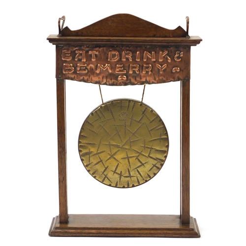 1 - Arts & Crafts oak and copper dinner gong embossed Eat Drink and Be Merry, 39cm high