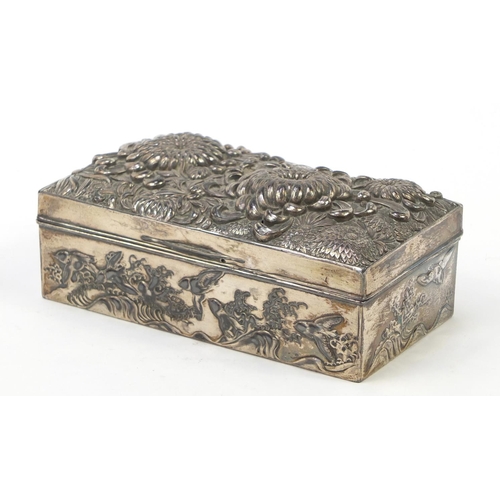 171 - Japanese silver coloured metal casket embossed with flowers, birds and waves, 17cm x 9cm x 5.2cm