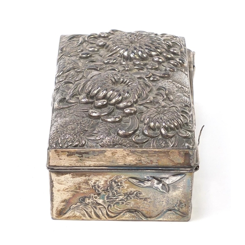 171 - Japanese silver coloured metal casket embossed with flowers, birds and waves, 17cm x 9cm x 5.2cm