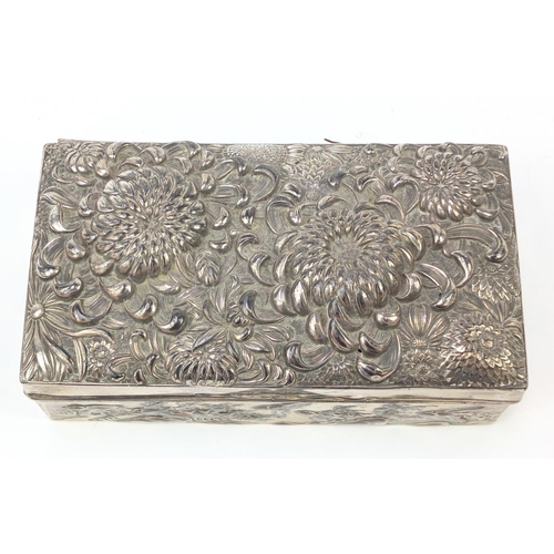 171 - Japanese silver coloured metal casket embossed with flowers, birds and waves, 17cm x 9cm x 5.2cm