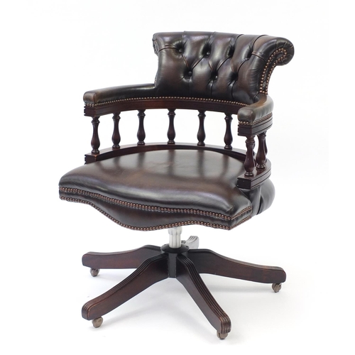 857 - Mahogany framed captain's chair with brown leather button back upholstery, 85cm high