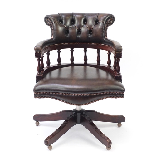 857 - Mahogany framed captain's chair with brown leather button back upholstery, 85cm high