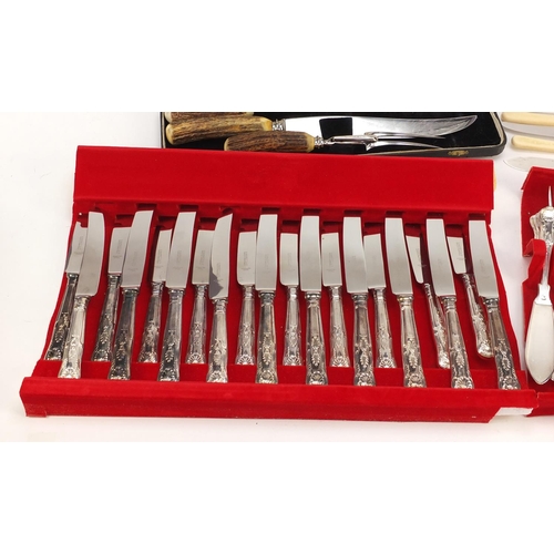 2481 - Silver plated and stainless steel cutlery and a three piece carving set with horn handles