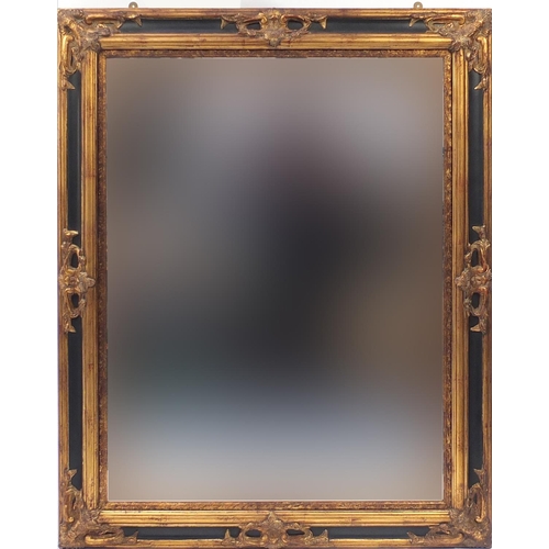 827 - Large rectangular gilt framed and ebonised bevel edged mirror, 144cm x 117cm