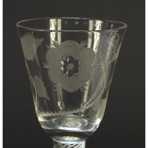 52 - 18th century Jacobite wine glass having a rounded funnel bowl engraved with a rose and foliage, on m... 