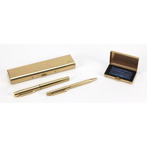 1984 - Sheaffer brass fountain pen and ballpoint pen set, with box, the fountain pen with 14K gold nib