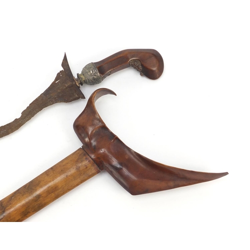 244 - Javanese Kris with carved wooden handle and sheaf, 45cm in length