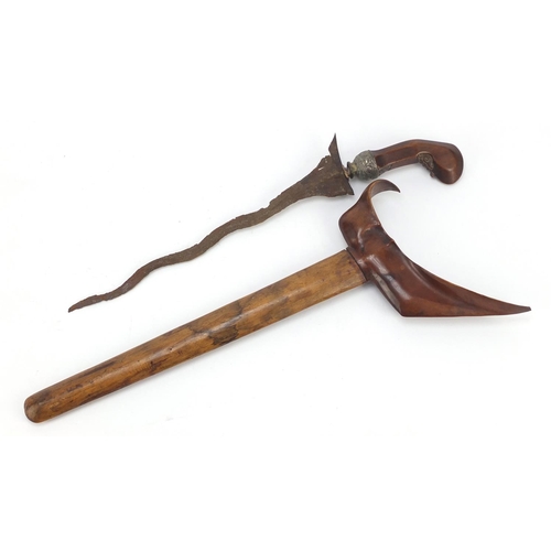 244 - Javanese Kris with carved wooden handle and sheaf, 45cm in length