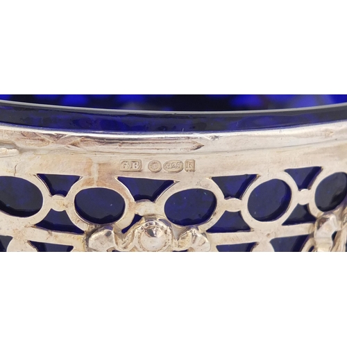 138 - Swedish 830 silver twin handle pedestal bowl with blue glass liner, cast and pierced with bows and s... 