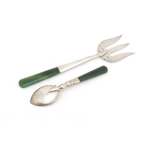 309 - George V silver fork and teaspoon with nephrite handles, the spoon inscribed New Zealand to the bowl... 