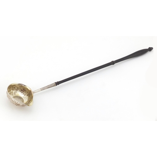 270 - 18th century unmarked silver toddy ladle with turned wood handle, the embossed bowl inset with a Mex... 