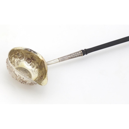 270 - 18th century unmarked silver toddy ladle with turned wood handle, the embossed bowl inset with a Mex... 